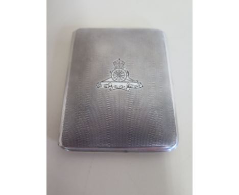 A silver cigarette case, London 1933, it’s outer casing engraved with the Royal Artillery insignia, its interior also with en