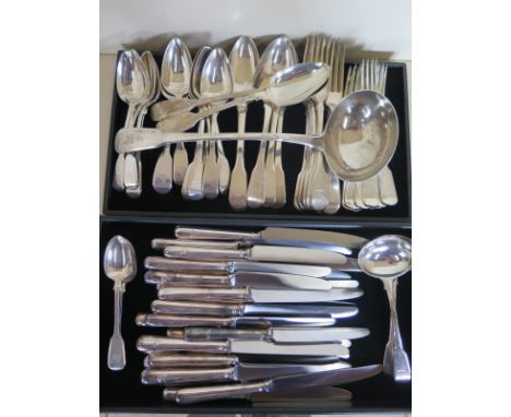 A collection of Georgian and Victorian silver flatware with the same family crest, 8 x table forks, 7 table spoons, 12 desser