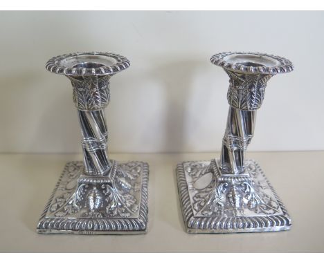 A pair of Victorian silver candlesticks with weighted bases, 12cm tall, London 1860/61 - maker JTS John Aldwinckle and James 