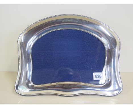 A Kidney shaped sterling (925) silver photo frame - 26cm x 33cm - clean condition, minor dents 