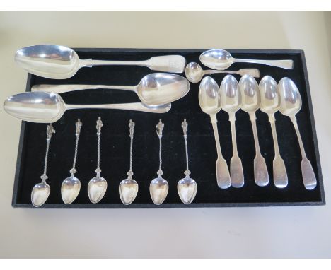 A collection of 16 various silver spoons including two Georgian table spoons, a Victorian serving spoon, 6 apostle spoons, ap