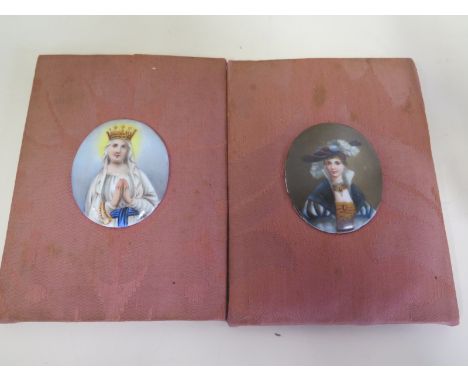 Two hand painted portrait porcelain oval plaques on a material base - 18cm x 8cm 