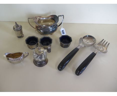 A silver sugar bowl, three silver salts, a silver pepper, a small silver jug, a silver and glass grinder and two white metal 