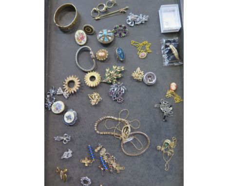 A small selection of costume jewellery including a gold plated bangle 