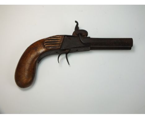 A 19th century twin barrelled percussion pistol, the barrels of octagonal form, no visible markings, with light walnut grip, 