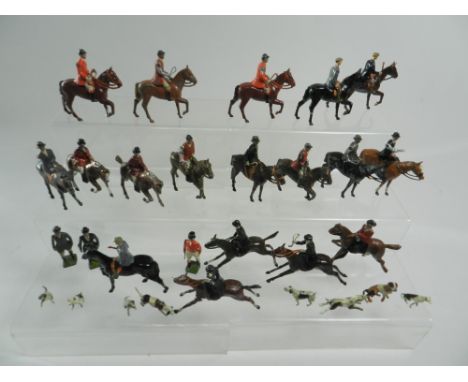 A group of twenty one fox hunting figures by Britains and others, items include standing and mounted figures and a further ei