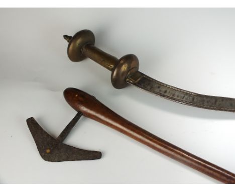 A Dervish style axe, 53cm long, together with a decorative sword with curved blade and partially engraved decoration, perhaps