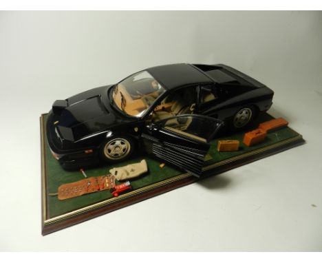 A Ferrari Testarossa 1/8 scale model by Pocher, a fully built kit finished in black and in a fitted glass presentation case c