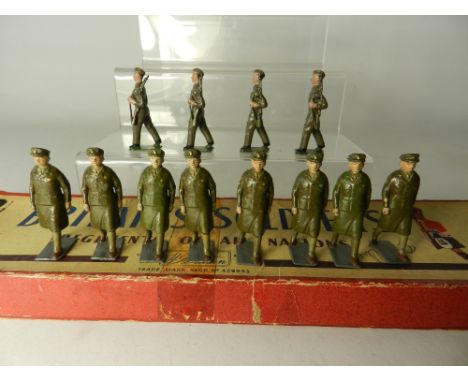 A boxed Britains set, the Womans Royal Army Corps, eight figures, also to include four marching infantry men (12)