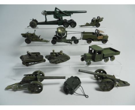 A group of Britains military equipment to include a Long Tom cannon, search light, Naval guns, Beetle lorry and others 
