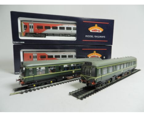 Two Bachmann boxed diesel units, a No. 32-900n two car DMU in BR green with speed whiskers, a two car diesel unit in Northern