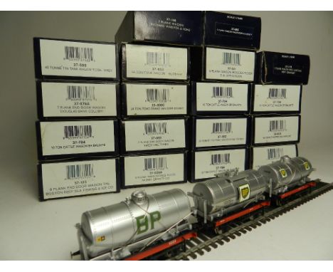 Nineteen boxes of Bachmann rolling stock wagons to include a set of three Esso wagons,  cattle wagons, plank wagons and other