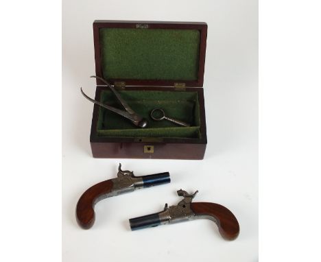 A pair of 19th century percussion pocket pistols, bears engraved signature for 'Manton, London', with blued 4.5cm barrels and