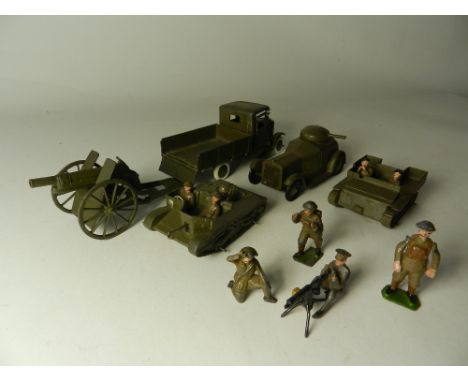 A group of restored Britains army vehicles and figures to include a four wheel army wagon with driver, a Royal Artillery gun,