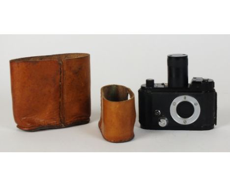 A Robot II Luftwaffen-Eigentum camera body, no lens, serial F 54734-5, with long advance knob, an aluminium body, 10cm high o
