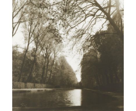 Lynn Geesaman (American, 1938-2020). Gelatin silver print photograph titled "Parc de Courances, France" depicting a stream li