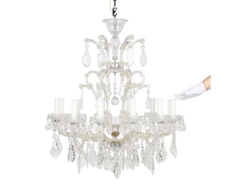 Maria Theresa style molded glass and cut crystal chandelier. With twelve lights. The glass lined frame with two tiers of hang