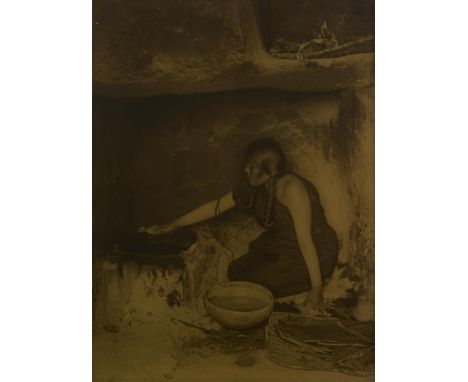 Edward Curtis (American, 1868-1952). Orotone gold-tone photograph titled "Piki Maker" depicting a Native American woman cooki