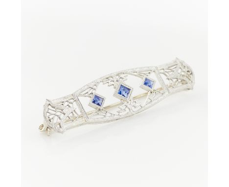 14k white gold filigree brooch set with three square cut sapphires. With locking safety clasp closure marked 14k and other un