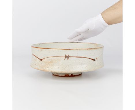 Warren MacKenzie (American, 1924-2018). Studio pottery ceramic bowl with drop-rim. Stoneware with a shino glaze with barbed w