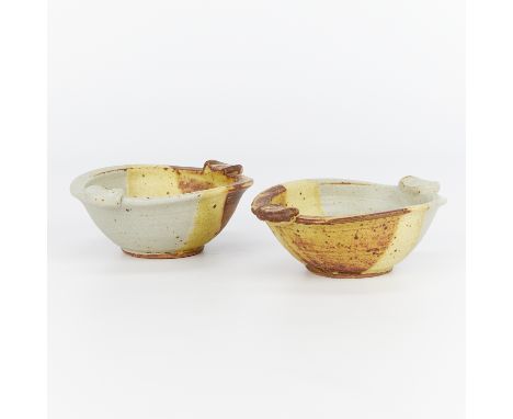 Warren MacKenzie (American, 1924-2018). Two studio pottery ceramic bowls with two applied handles along the upper rim. Stonew