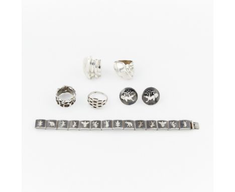 Group of six pieces of sterling silver jewelry including a bracelet and a pair of earrings from Siam, marked "Amfarco sterlin