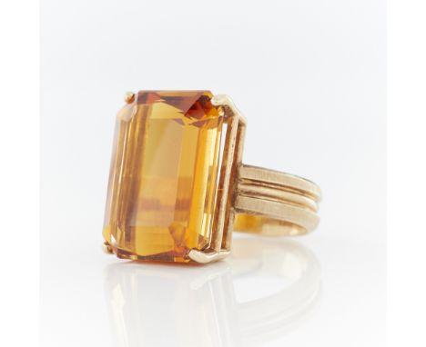 14k yellow gold ring set with large step cut orange yellow citrine (approx. 19.70 ct) on a reeded band with brushed texture d