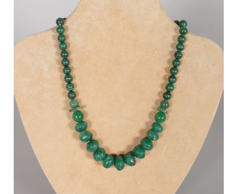 A GREEN JADE NECKLACE.