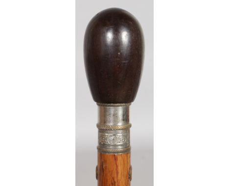 AN UNUSUAL PATENT CIGARETTE LIGHTER WALKING STICK, FRENCH, CIRCA. 1910, the hardwood top unscrewed from the shaft to reveal a