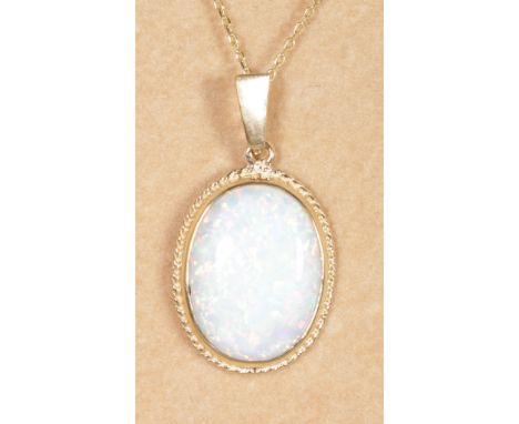 A 9CT GOLD AND OPAL PENDANT AND CHAIN.