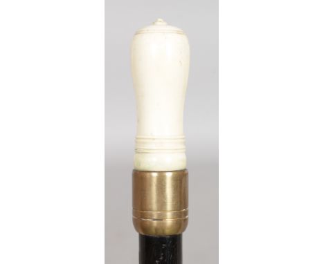 AN IVORY APPLE CORER ON A MALACCA SHAFT. Date: 1900.  Country: European. A picnic stick formed with an ivory two part apple c