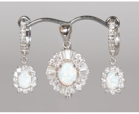 A SILVER, OPAL AND BRILLIANT PENDANT and MATCHING PAIR OF EARRINGS.