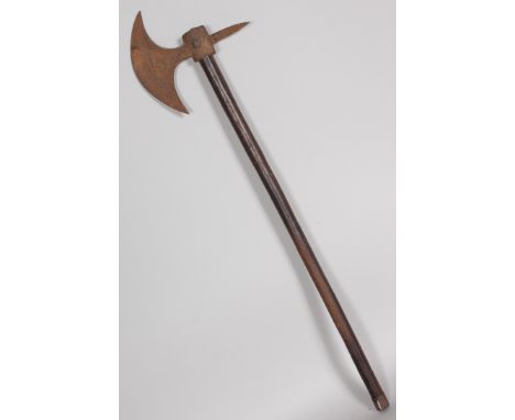 AN INDIAN AXE, crescent shaped blade with scroll decoration, plain spike opposite, on ebonised hafi with steel tip, 28.5ins ,