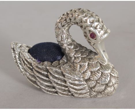 A LARGE SILVER SWAN PIN CUSHION.