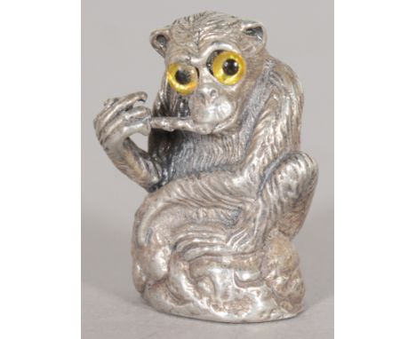 A SILVER MONKEY PIN CUSHION.