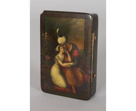 A VICTORIAN PAPIER MACHE SNUFF BOX, the lid painted with Turkish lovers.