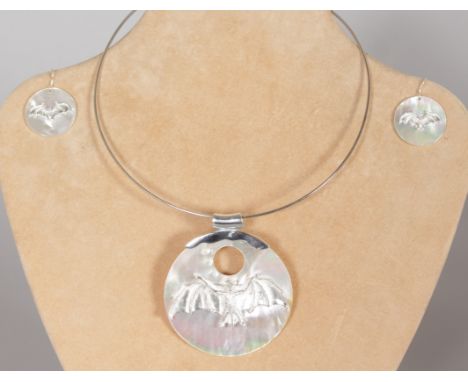 A GOOD SILVER AND MOTHER-OF-PEARL BAT PENDANT on silver chain, and MATCHING EARRINGS.