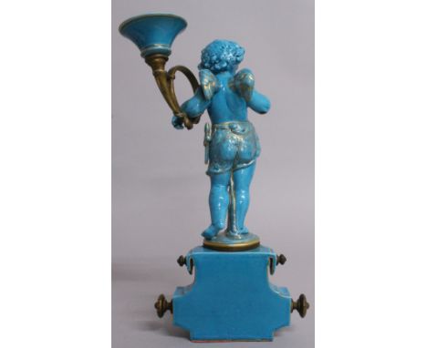 A GOOD 19TH CENTURY SEVRES LIGHT BLUE CUPID CANDLE STAND, as a winged cupid holding an ormolu and porcelain candle holder. 12