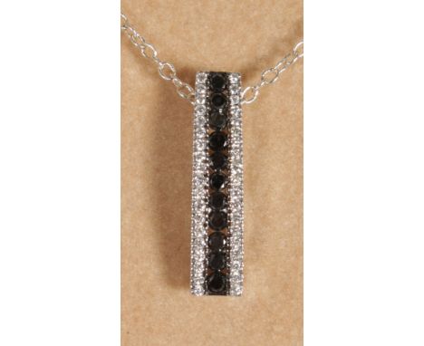 AN 18CT WHITE GOLD SAPPHIRE AND DIAMOND DROP PENDANT on chain.