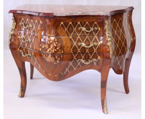 A LOUIS XVI STYLE KINGWOOD COMMODE, of bombe form, with marquetry inlay and ormolu mounts, the three long drawers supported o