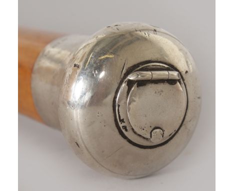 A RARE BRIGGS SILVER TOPPED CIGARETTE CANE, C1900.   The top is silver and hallmarked. 36ins long.