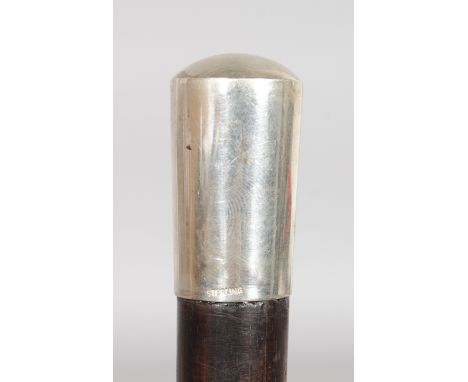 A COROMANDEL STICK WITH STERLING SILVER HANDLE.  32ins long.`