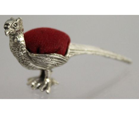 A SILVER NOVELTY PHEASANT PIN CUSHION.