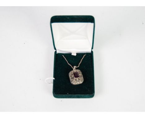 SILVER AND MARCASITE OBLONG, HINGE OPENING VINAIGRETTE PENDANT, COLLET SET WITH OBLONG AMETHYST, ON A SILVER ROPE CHAIN NECKL