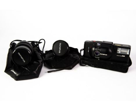 OLYMPUS XA POCKET ROLL FILM CAMERA WITH A16 ELECTRONIC FLASH ATTACHED, and instruction manual, together with an OLYMPUS OM- S