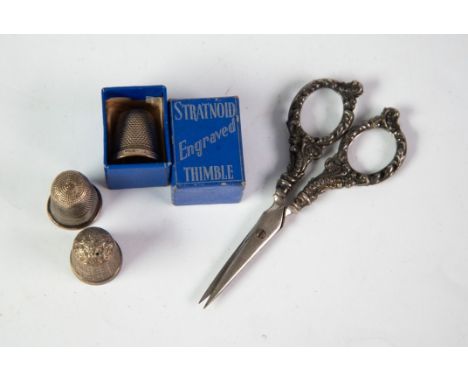 STRATNOID SILVER THIMBLE, boxed; 2 various hallmarked SILVER THIMBLES and a pair of needleworker's small STEEL SCISSORS with 
