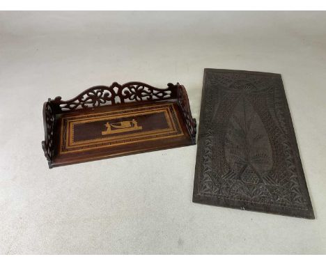 A 19th century Sorrento ware inlaid book trough, width 49cm, and a carved oak panel, 69 x 34cm (2).