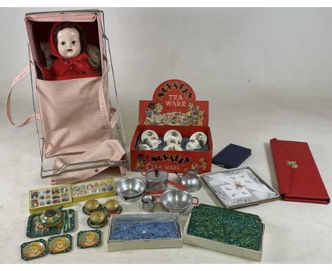 A quantity of nursery ware items, together with a cot, doll's tea set and cooking equipment, also knitting needles and bags.