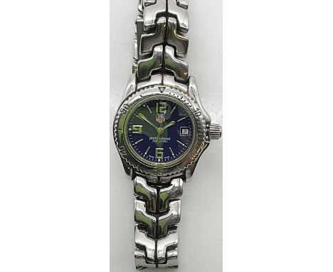 TAG HEUER; a lady's stainless steel wristwatch with date aperture, Arabic numerals and baton markers to the blue dial, with i