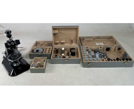 REICHERT, AUSTRIA; a binocular electronic microscope, No. 357053, with four cased sets of accessories